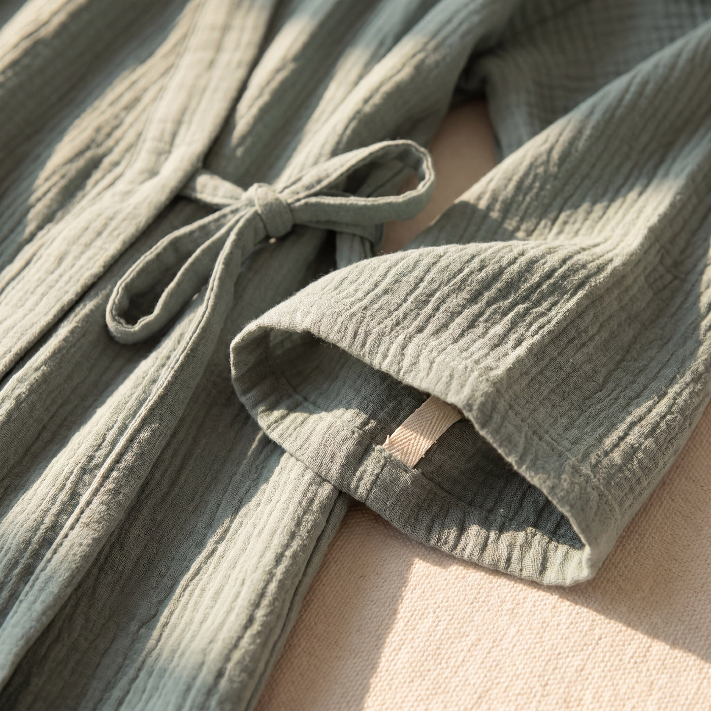 Close-up of sage cotton fabric used in SagePause kimono pajamas