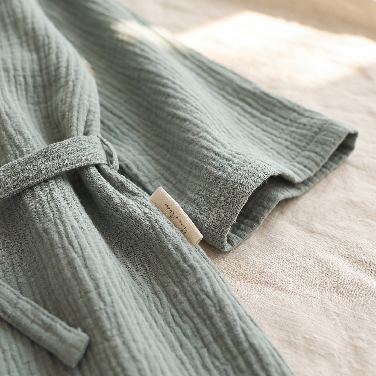 SagePause kimono pajama set in sage — fabric texture close-up — soft breathable cotton